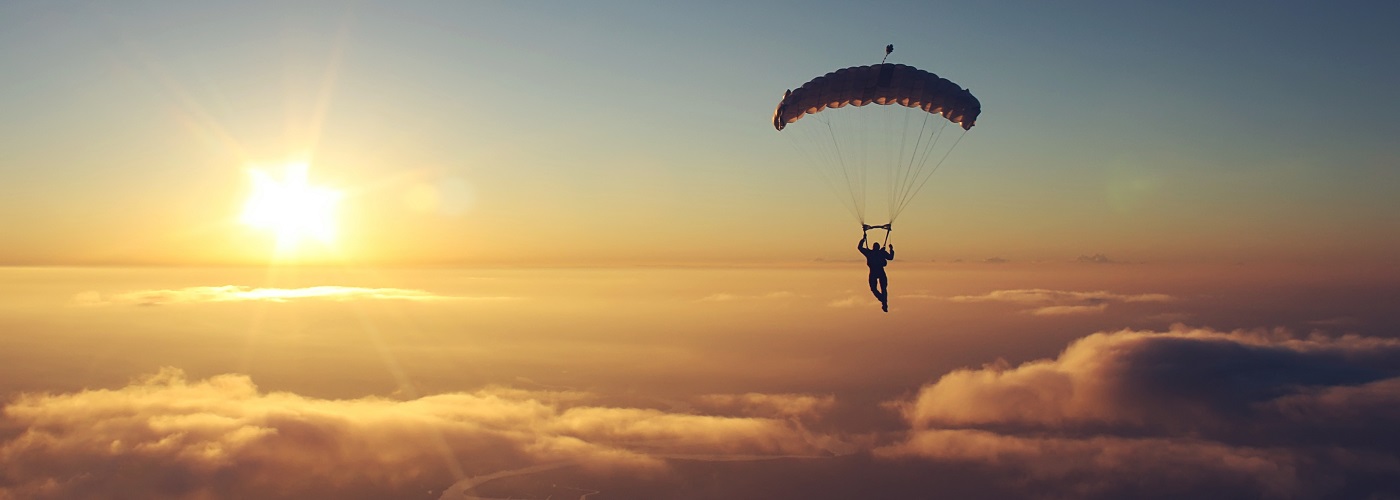 Skydiver with sunset in background