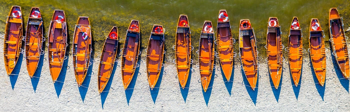 Looking down on a line of rowing boats