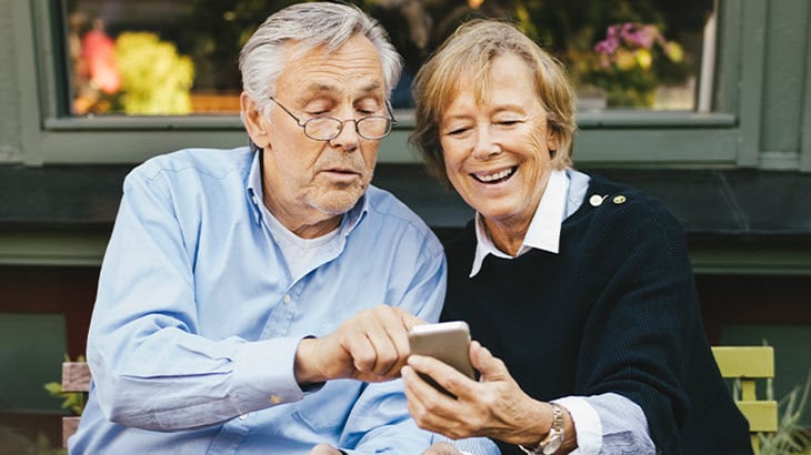 image of retirees with iPhone